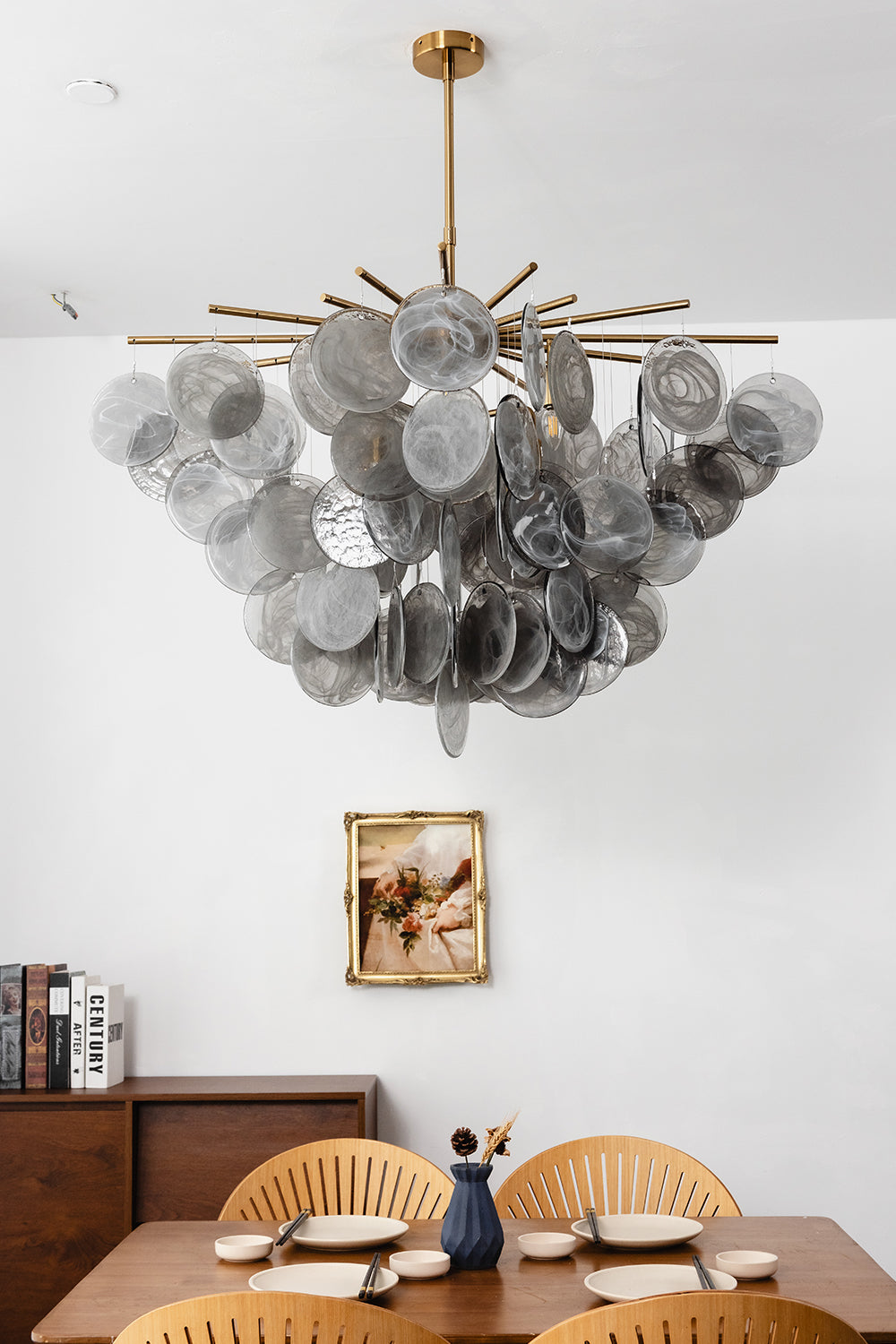 Nimbus Smoked Glass Disc Chandelier displayed in a modern dining area, featuring hand-blown glass discs.