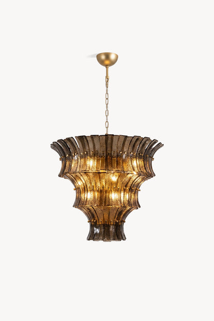 Octavia Sculptural Smoked Glass Chandelier | Studio Presentation | Clean front studio view of the tall tiered sculptural glass chandelier variant radiating a warm golden halo | vexa lamps