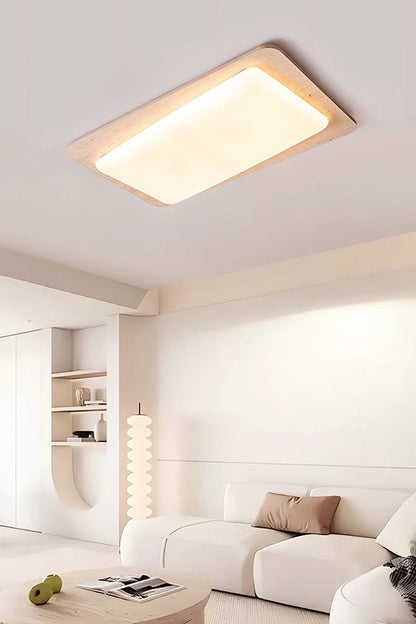 Rectangular stone ceiling light view 1 | Yellow Travertine, Acrylic | Installed on a white ceiling with warm glow | vexa lamps