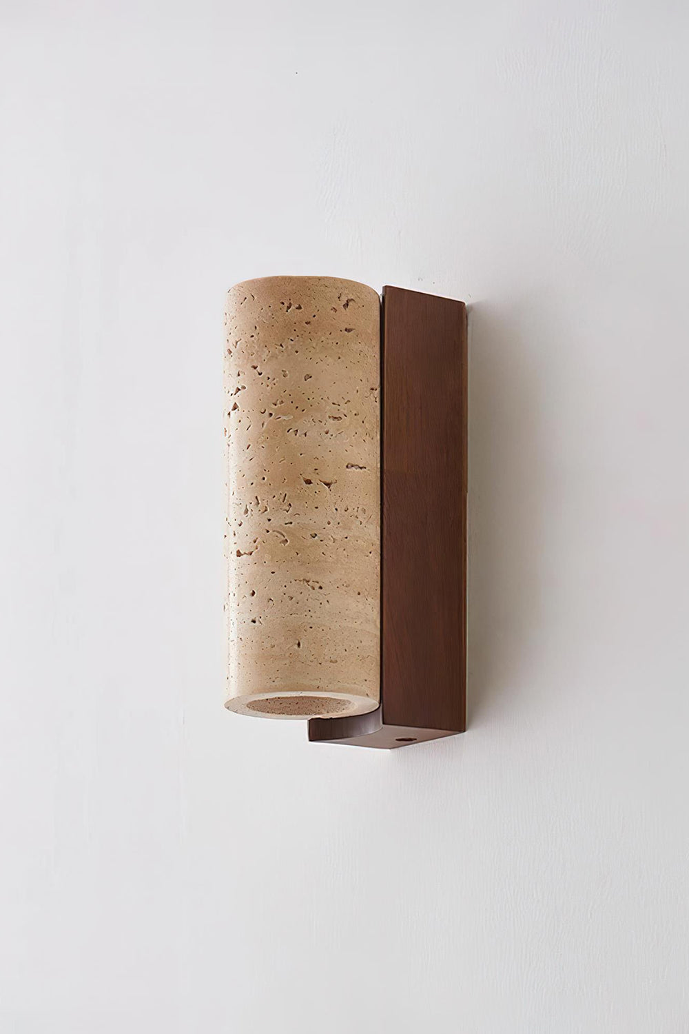 Outcrop Beige Travertine Wall Sconce | Travertine, Metal | Unlit side profile studio view of the organic natural stone wall lamp showcasing its minimalist curved form against a white backdrop | vexa lamps