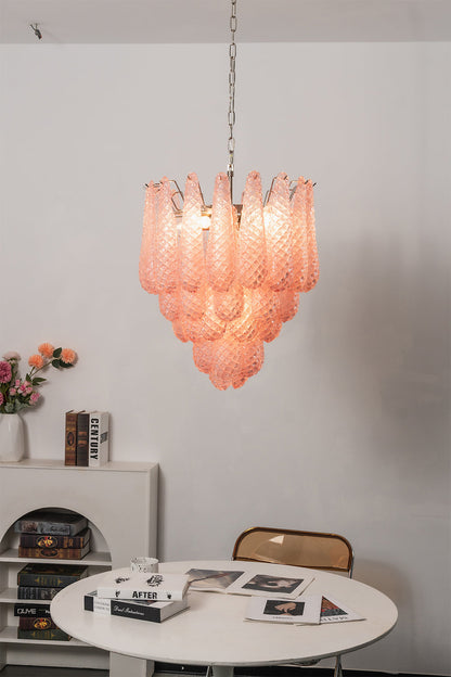Amara Blush Cascading Glass Chandelier | Glass, Metal | Hanging over a small round white table and chair in a minimalist residential corner | vexa lamps