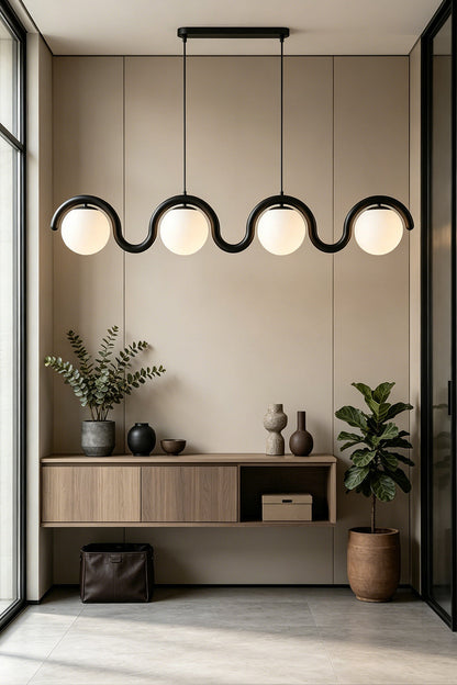 Rhythmic flow glass pendant with wavy black metal frame | Metal, Glass | Installed over a console table in a bright hallway | vexa lamps