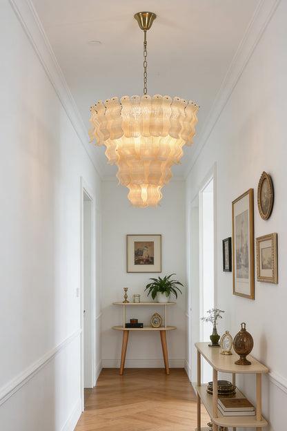 Elegant glass tiered chandelier | Metal | Glass | Hanging in a bright hallway with herringbone wood floors | vexa lamps