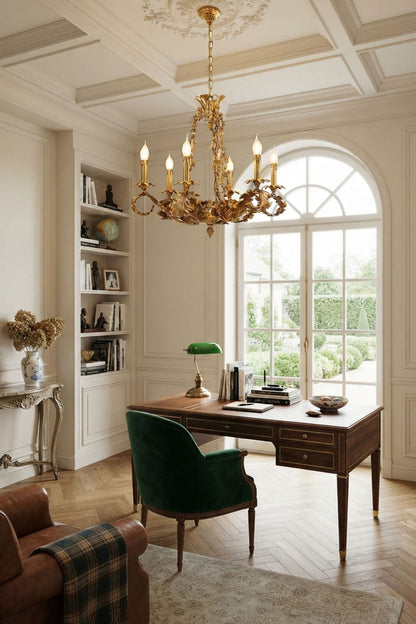 Rurik Acanthus Leaf Brass Chandelier illuminating a stylish office with wood desk and green accent chair.