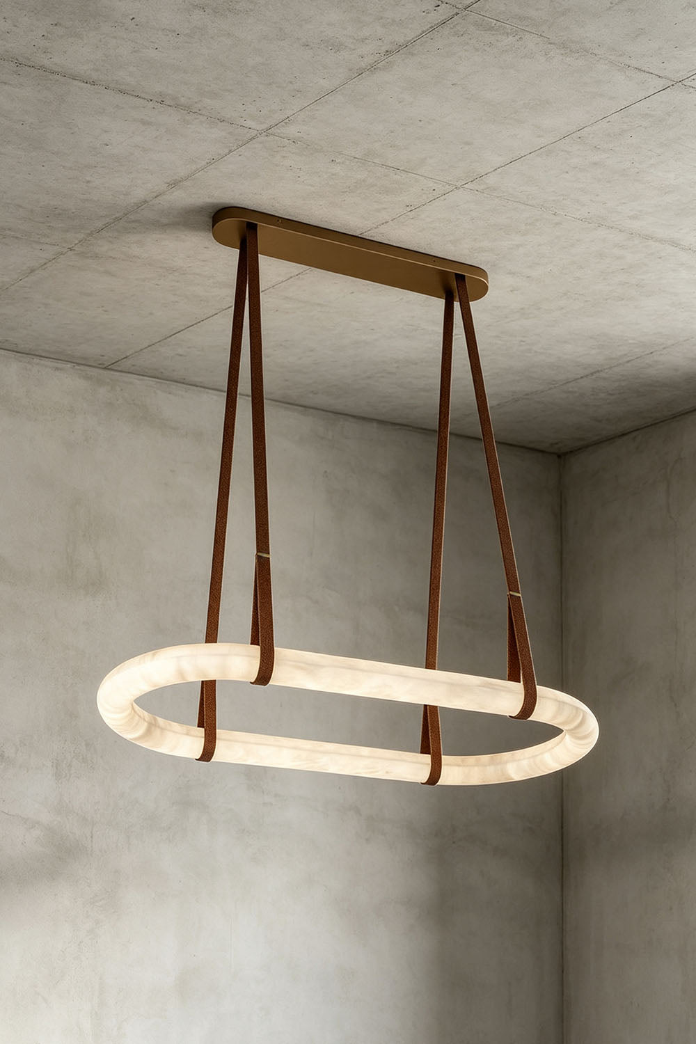 Selwyn Racetrack Alabaster Leather Pendant Light | Natural Alabaster, Leather and Metal | Angled illuminated view displayed against a concrete grey backdrop | vexa lamps