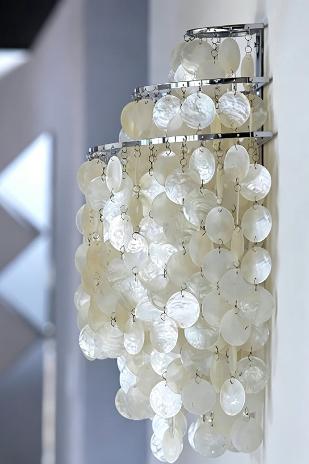 Side profile view of shell cascading light | Shell | Iron | Mounted on a wall showing the semi-circle layered shape | vexa lamps