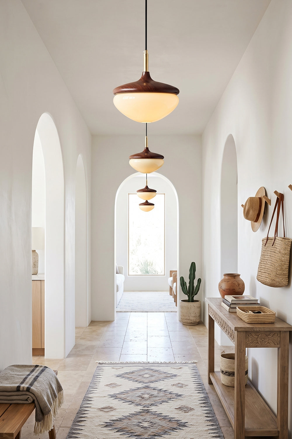 Soren Wood Grain Pendant Lamp | Wood, Glass, Metal | Multi-light installation lining a long, bright minimalist arched hallway with bohemian decor | vexa lamps