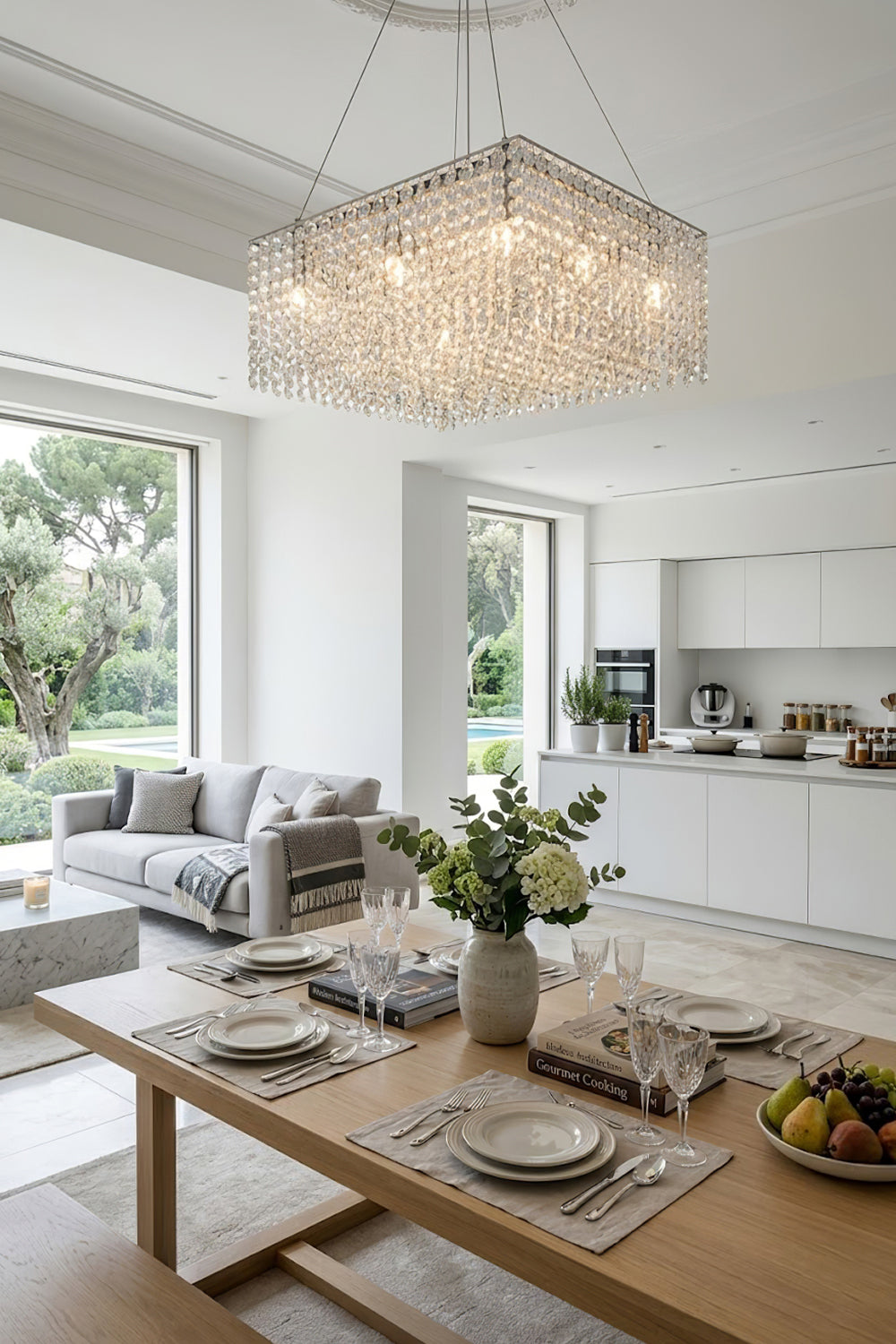 Modern rectangular crystal light over a wooden dining set | Stainless Steel, Crystal | Bright kitchen-dining area with white cabinetry | vexa lamps