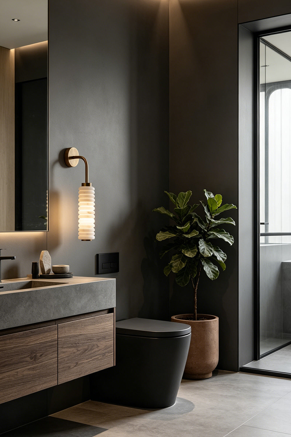 Stacked Strata Alabaster Wall Lamp | Metal, Alabaster | Lit lamp on grey wall in dark modern kitchen | vexa lamps