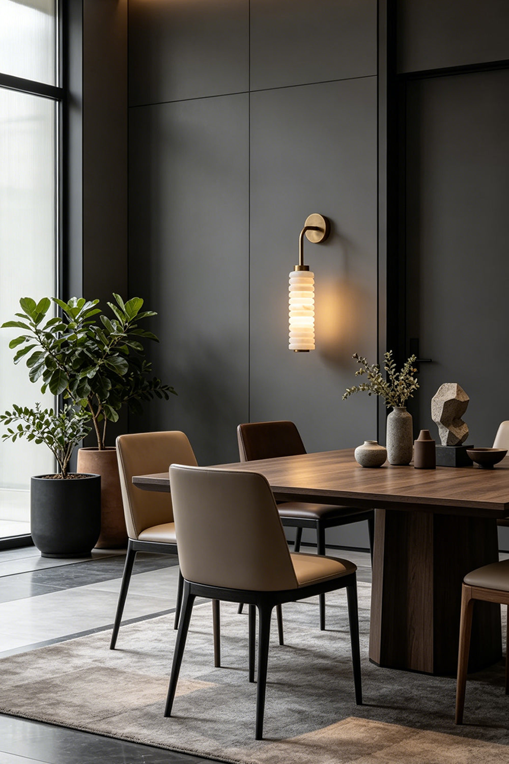 Stacked Strata Alabaster Wall Lamp | Metal, Alabaster | Lit lamp casting warm light in modern dining interior | vexa lamps