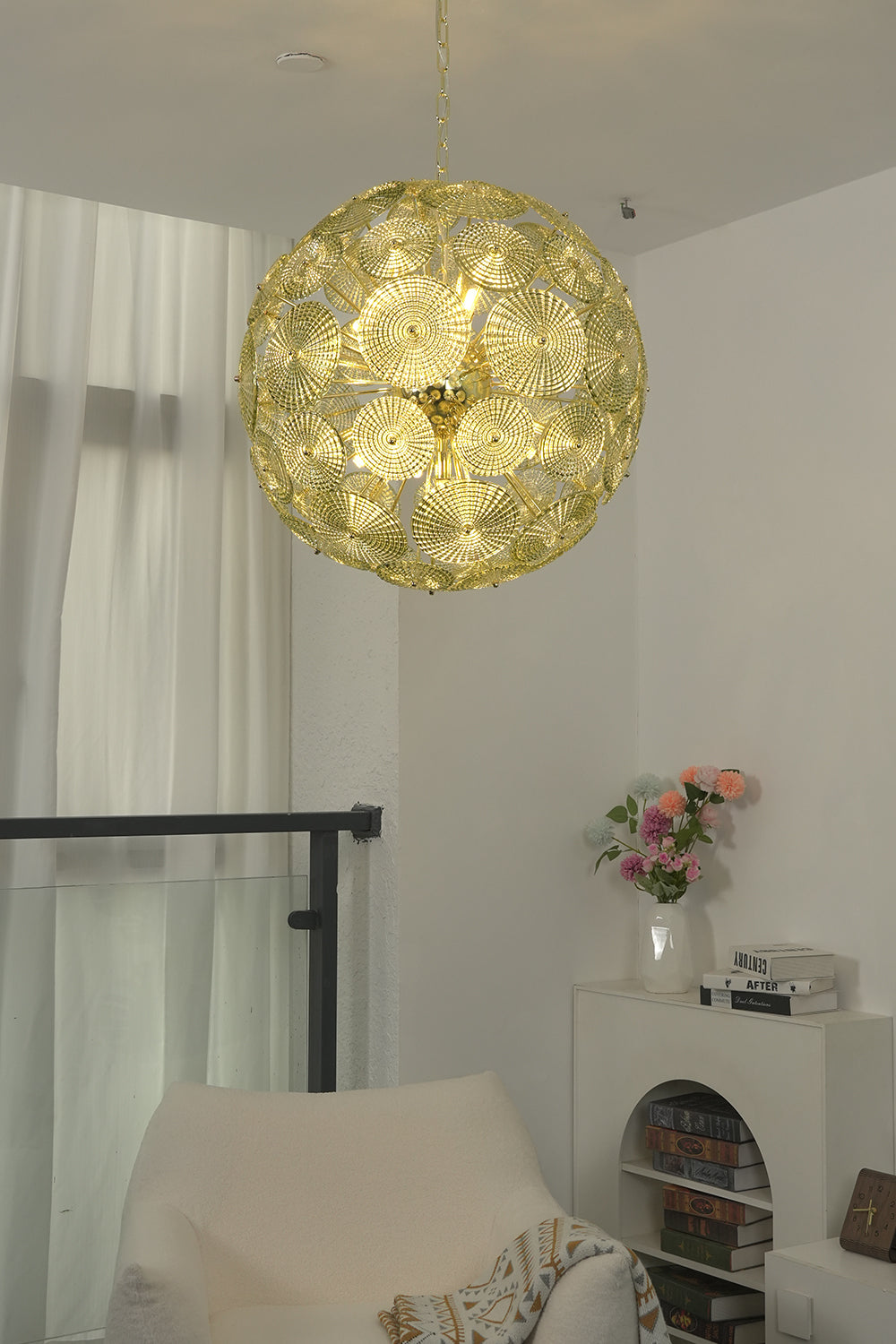 Detailed shot of lit glass spheres chandelier frame | Metal, Glass | Showing brass attachment and spheres structure | morylighting