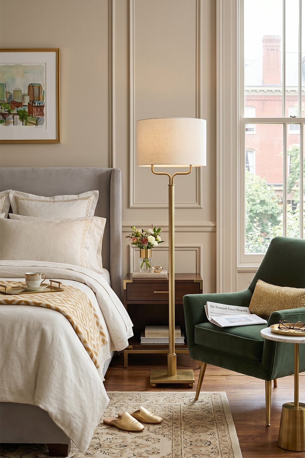Sutton Modern Brass Floor Lamp in an elegant bedroom setting with light curtains and stylish decor.