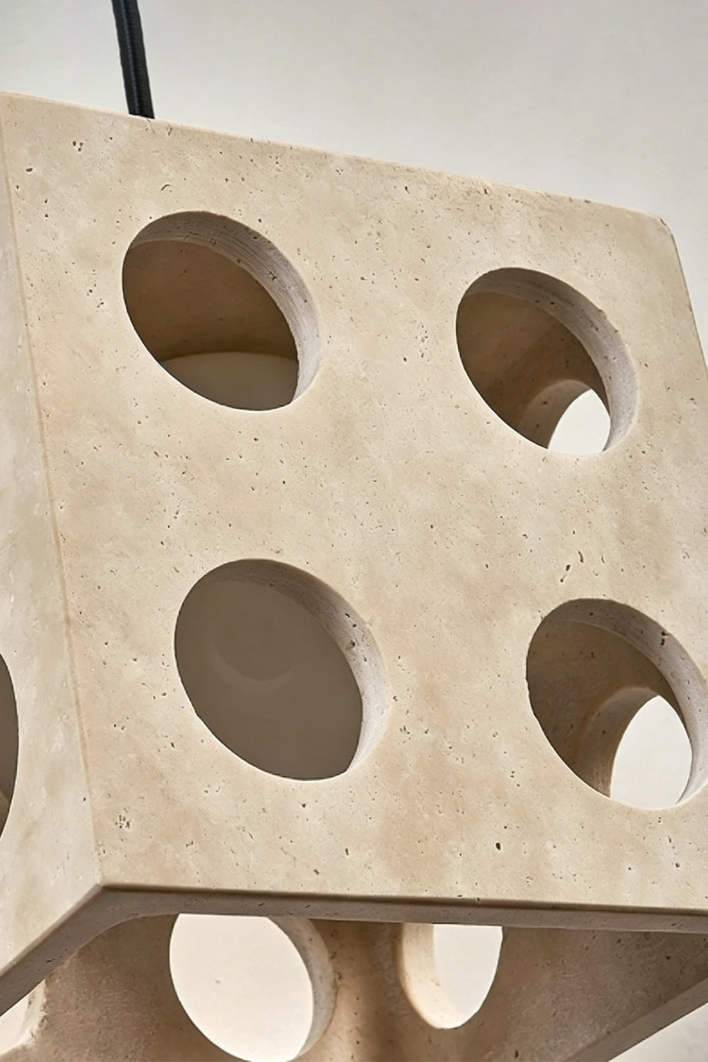 Terra Cube Travertine Pendant Light | Travertine, Metal | Close-up detail of unlit stone and hardware | vexa lamps