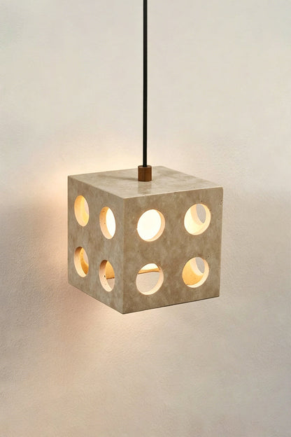 Terra Cube Travertine Pendant Light | Travertine, Metal | Lit product view showing light patterns against a wall | vexa lamps