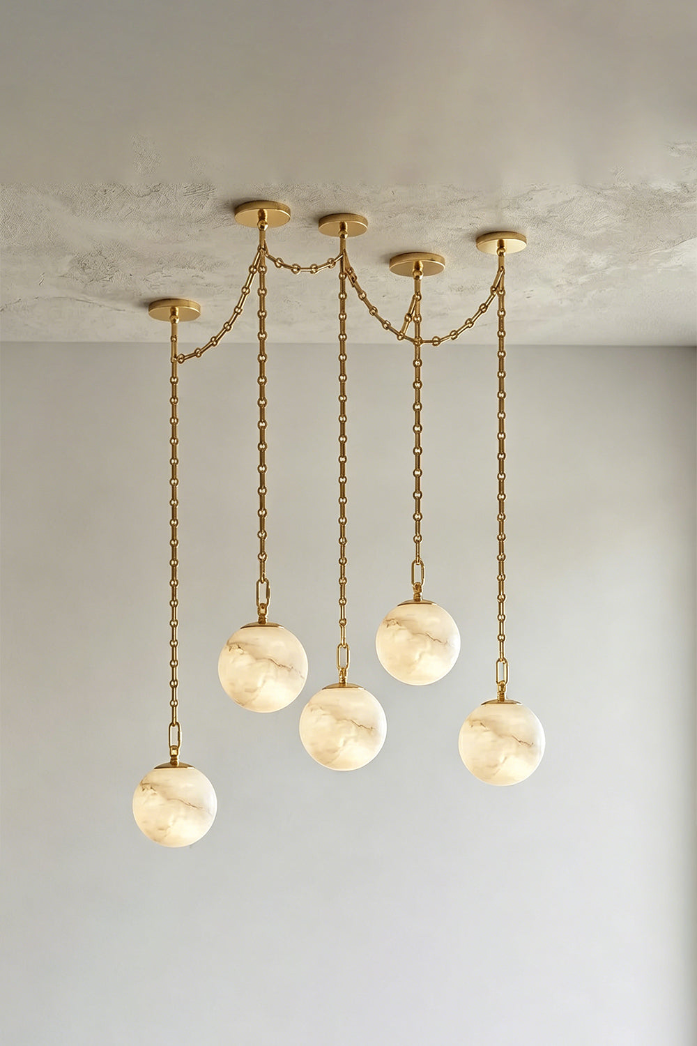 Thalia Alabaster Spherical Chain Chandelier with hand-carved alabaster spheres and brushed gold links.