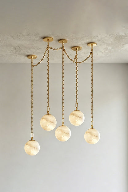 Thalia Alabaster Spherical Chain Chandelier with hand-carved alabaster spheres and brushed gold links.