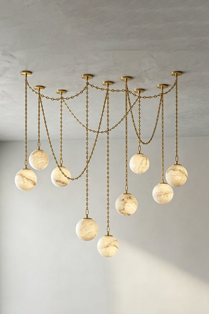 Thalia Alabaster Spherical Chain Chandelier with hand-carved alabaster spheres and brushed links.