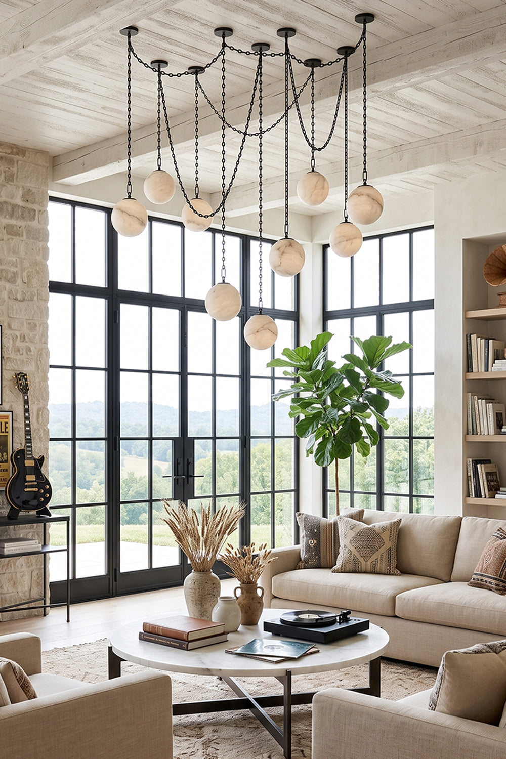 Thalia Alabaster Spherical Chain Chandelier showcasing seven hand-carved alabaster spheres in a stylish living room.