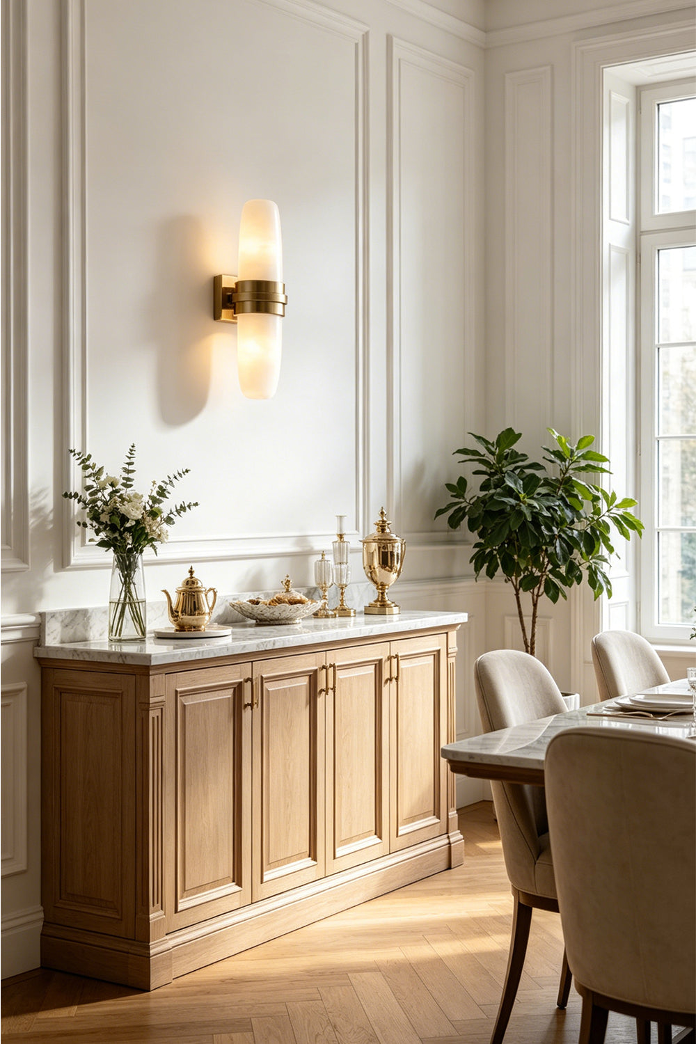 Theron Linear Alabaster Wall Lamp | Alabaster, Metal | Providing a warm ambient downlight and uplight glow above an elegant wooden dining room sideboard credenza | vexa lamps