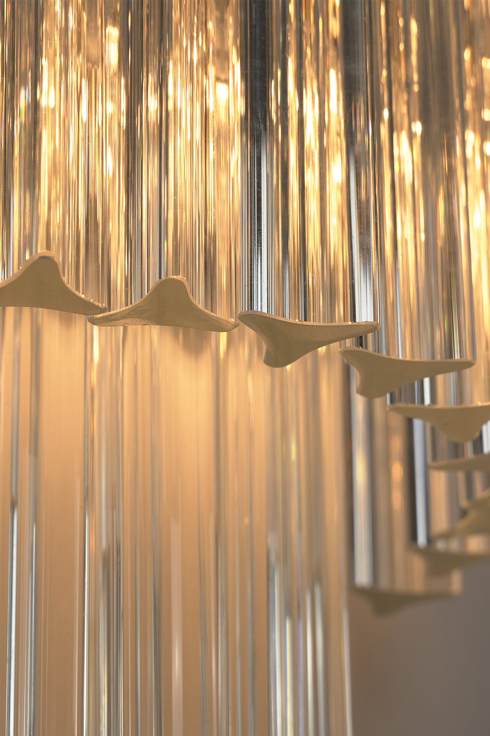 Angled close-up of lit glass rods | Metal, Glass | Detail view showing rod texture | morylighting