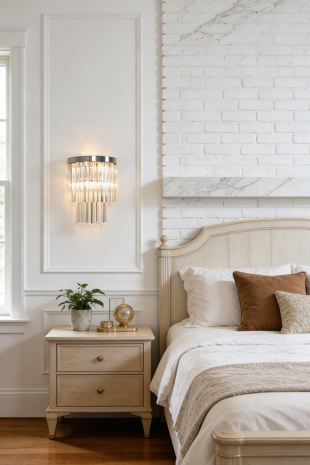 Lit tiered column glass wall light | Metal, Glass | Installed on a classic white wall over a bedside nightstand | morylighting