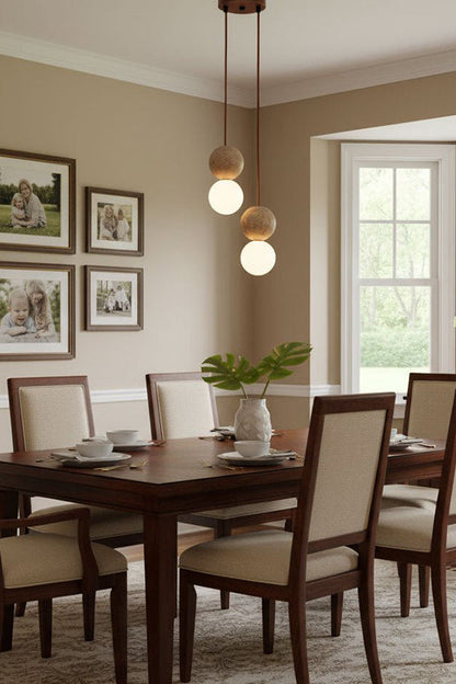 Pair of travertine stone pendants in a corner | Yellow Travertine, Glass | Traditional dining room scene with wooden furniture | vexa lamps