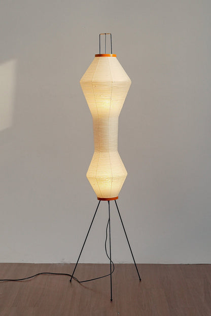 Verena Hourglass Paper Floor Lamp with soft pleated shade and slim black metal base.