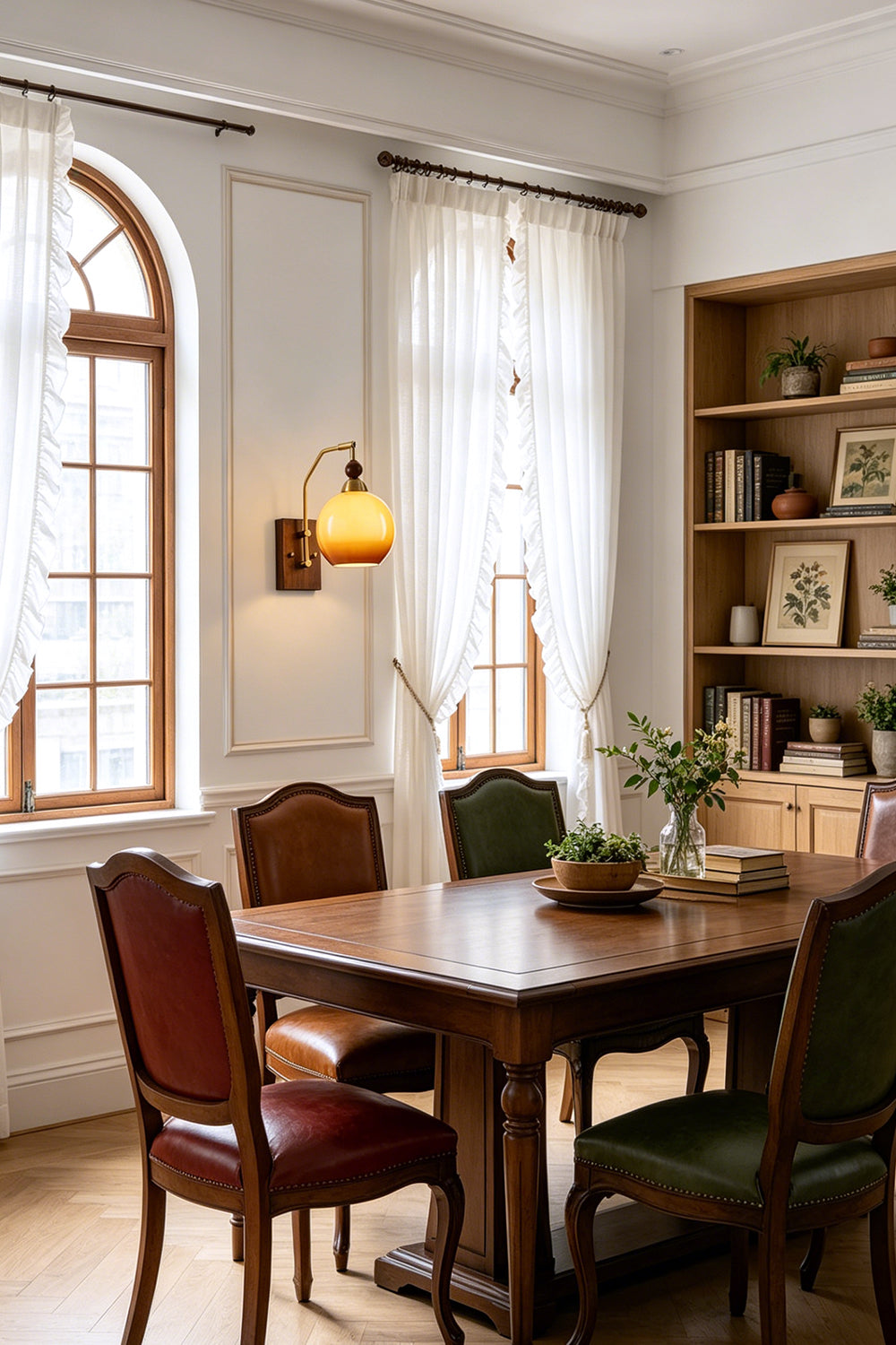 Vesper Caramel Gradient Wall Lamp | Glass, Metal, Wood | Installed as decorative accent lighting in an elegant classic dining room with a long wood table and leather chairs | vexa lamps