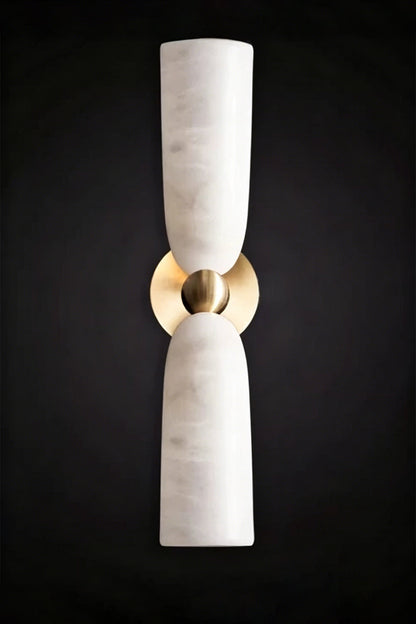 Vesperal Axis Alabaster Wall Lamp | Alabaster, Metal | Fully lit lamp showing the natural stone translucency against a dark dramatic background | Isolated product shot | vexa lamps