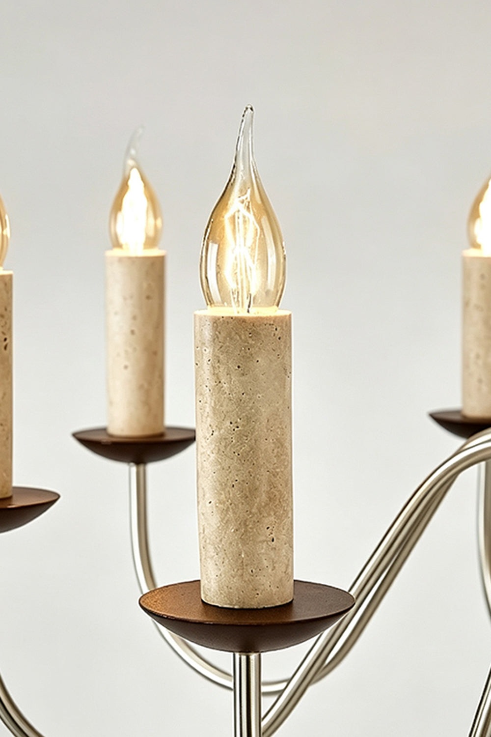 Winslow Travertine Candelabra Chandelier | Natural Travertine and Metal | Close-up view of the candle sleeves made of travertine stone | vexa lamps